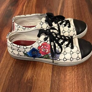 Brighton embroidered lace up sneakers.